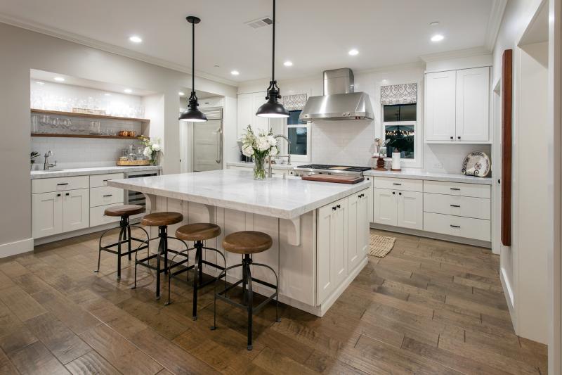 marble counters, shaker cabinets, stainless steel hood, floating shelves